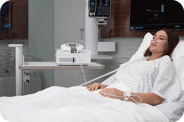 patient laying in bed connected to Masimo softflow