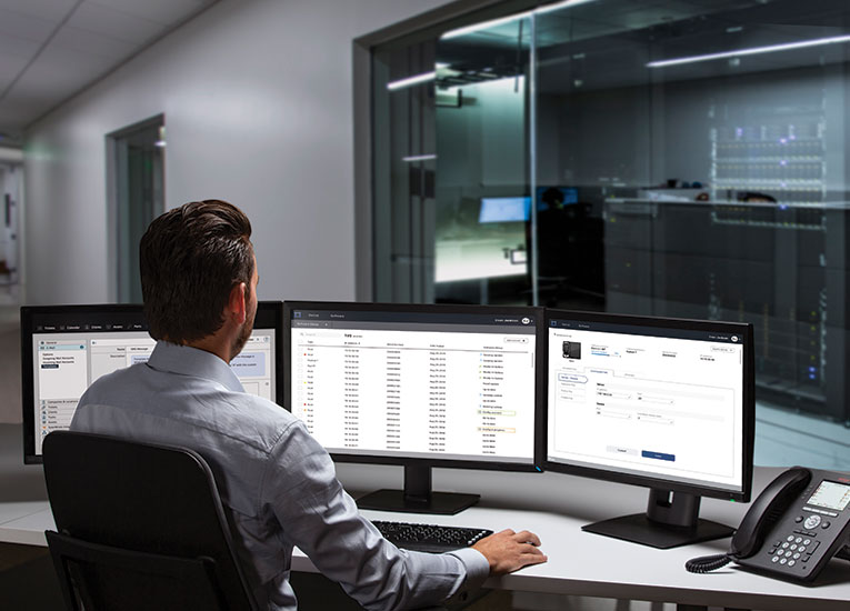 Masimo - Masimo Device Management Server (DMS) - Man in front of computers in server area